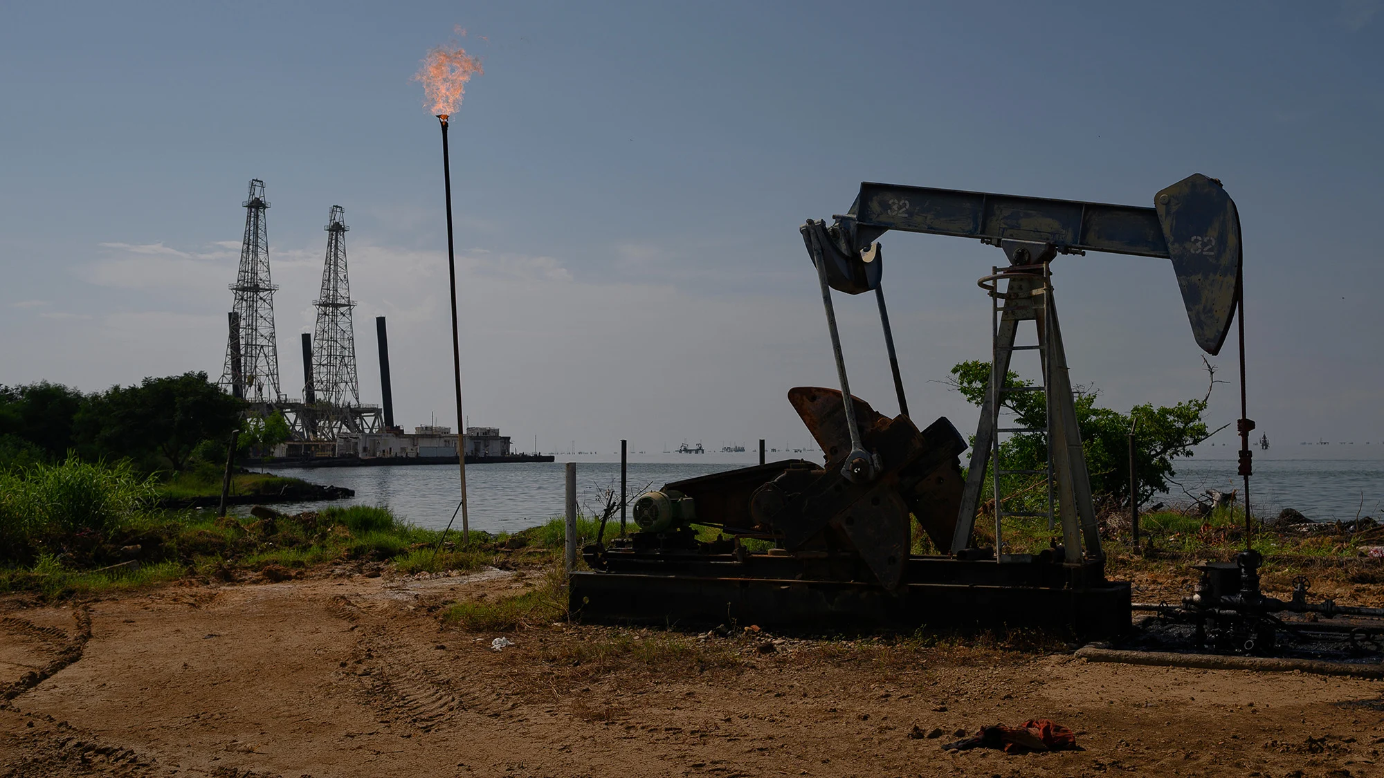 A Petroleos de Venezuela SA (PDVSA) oil pumpjack on Lake Maracaibo in Cabimas, Zulia state, Venezuela